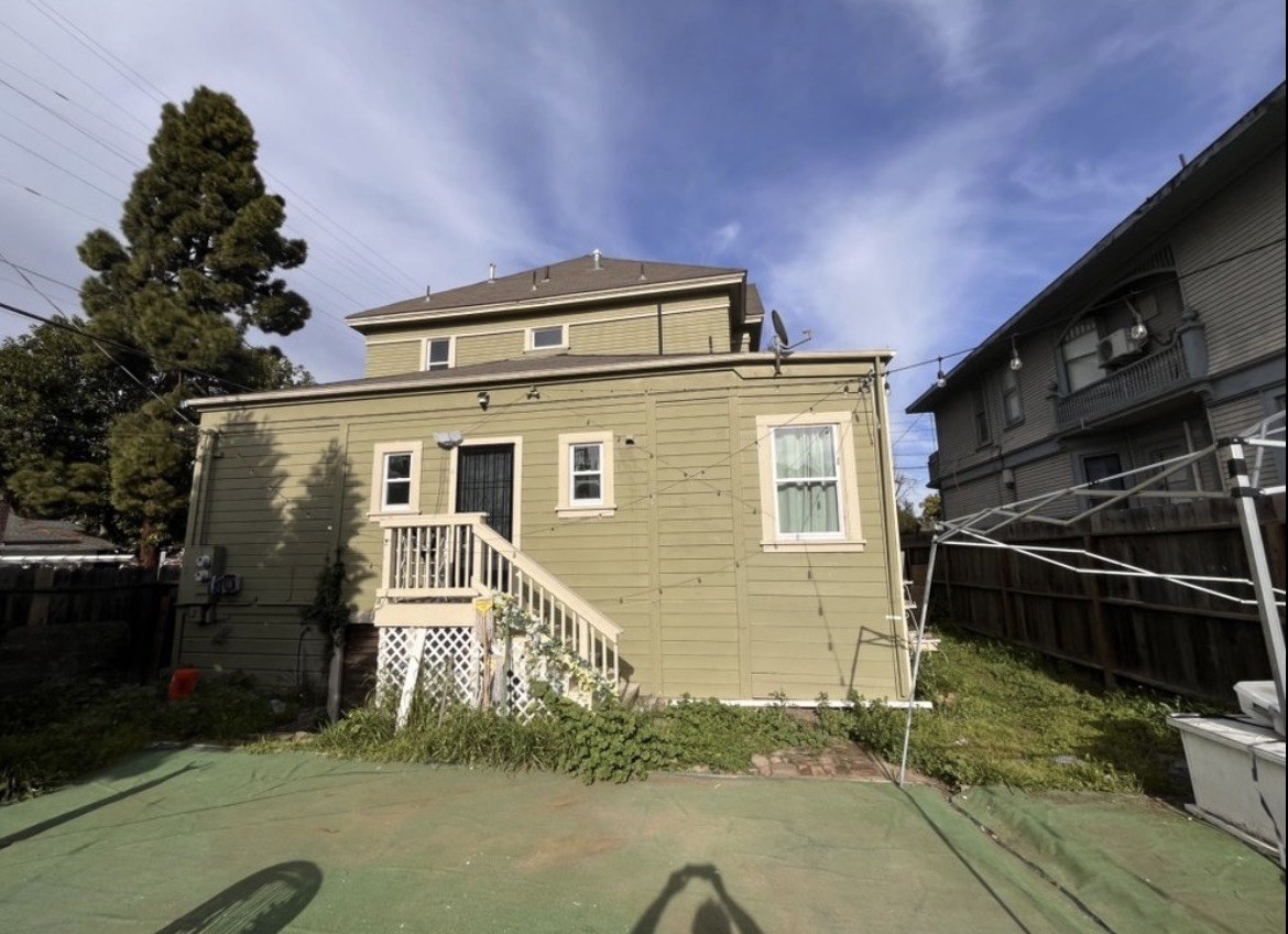 Repainted green home exterior with clean trim