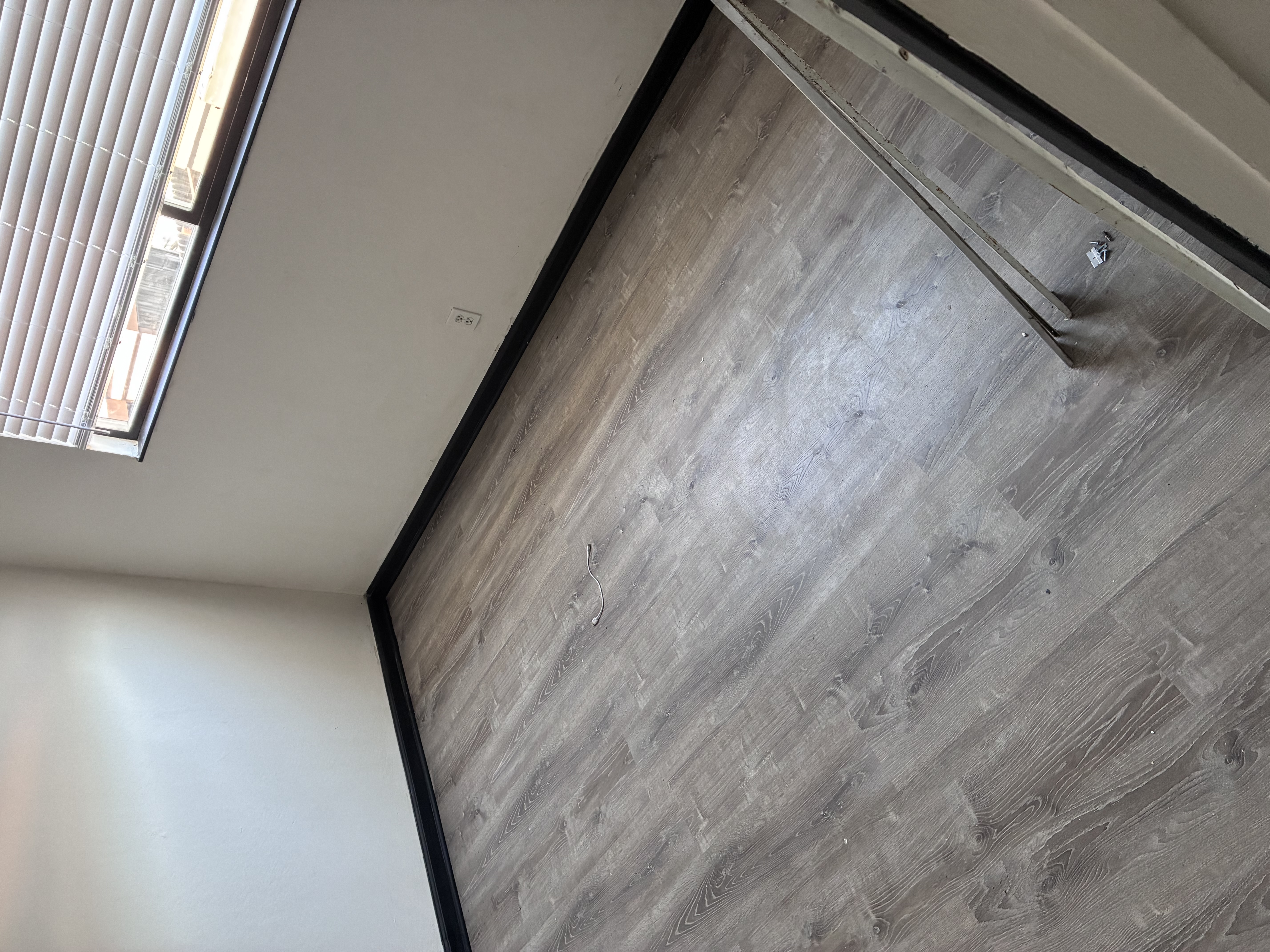 Modern vinyl plank flooring installed in bedroom