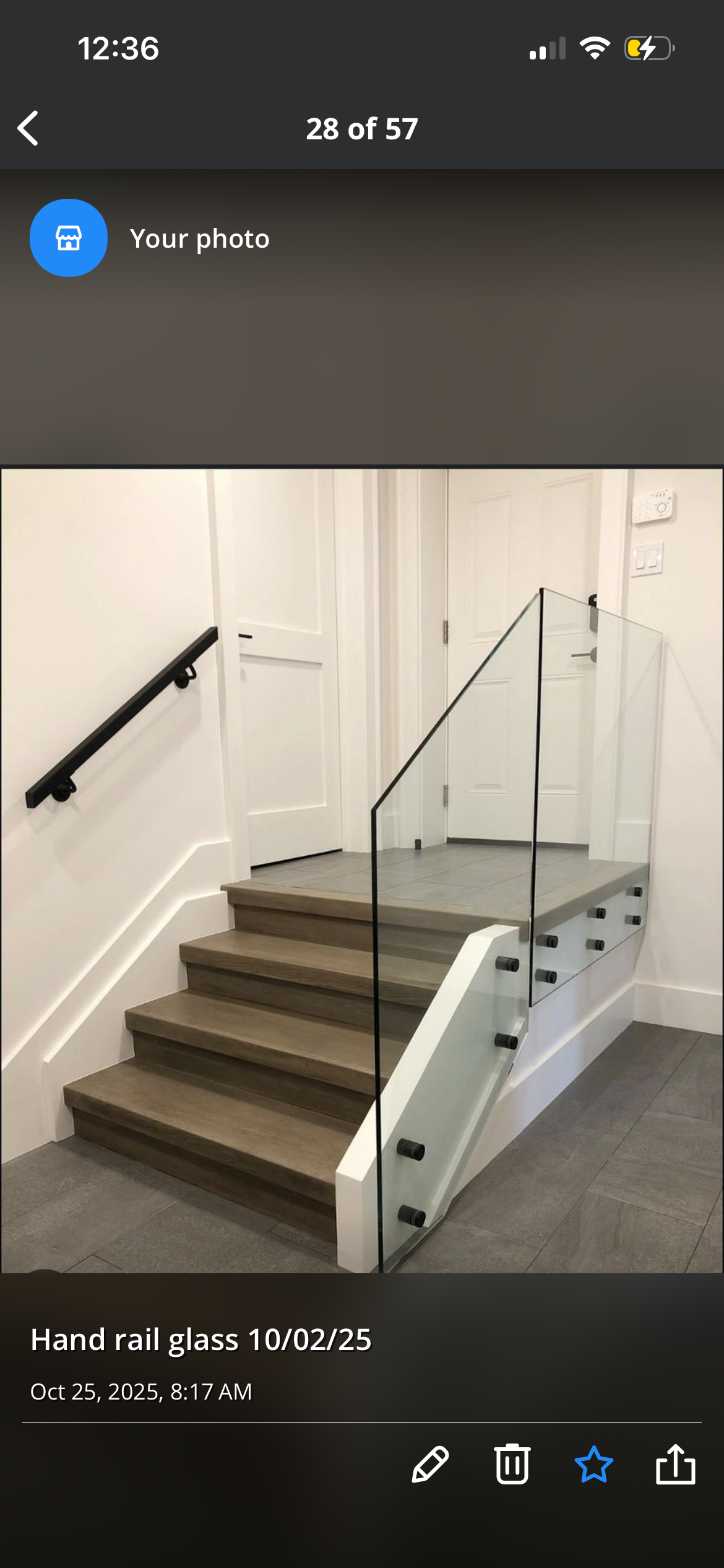 Custom glass handrail with metal hardware on stairs