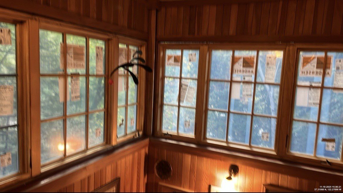 Large wall mirror installed in a dining area