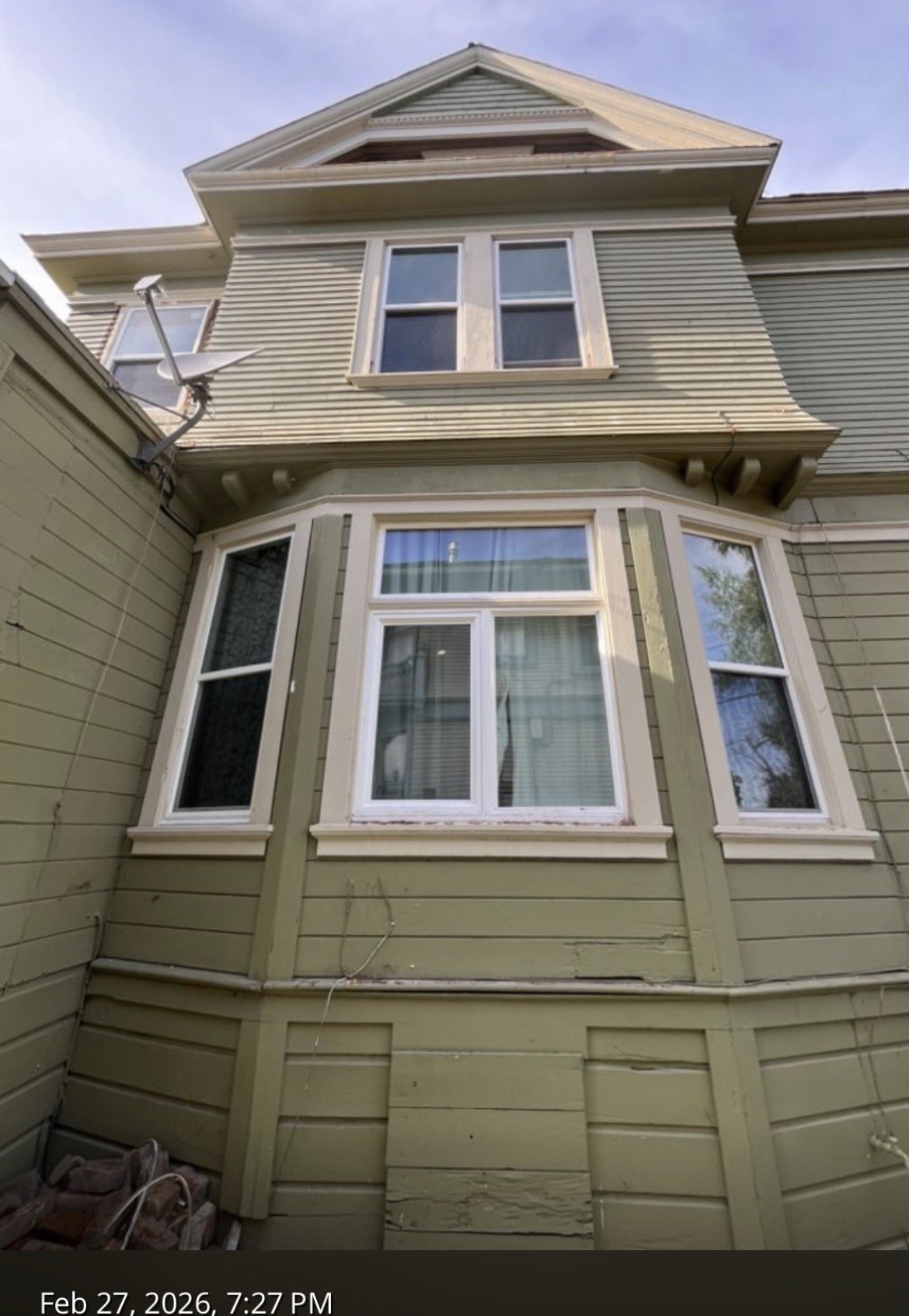 New white windows installed on a Victorian bay