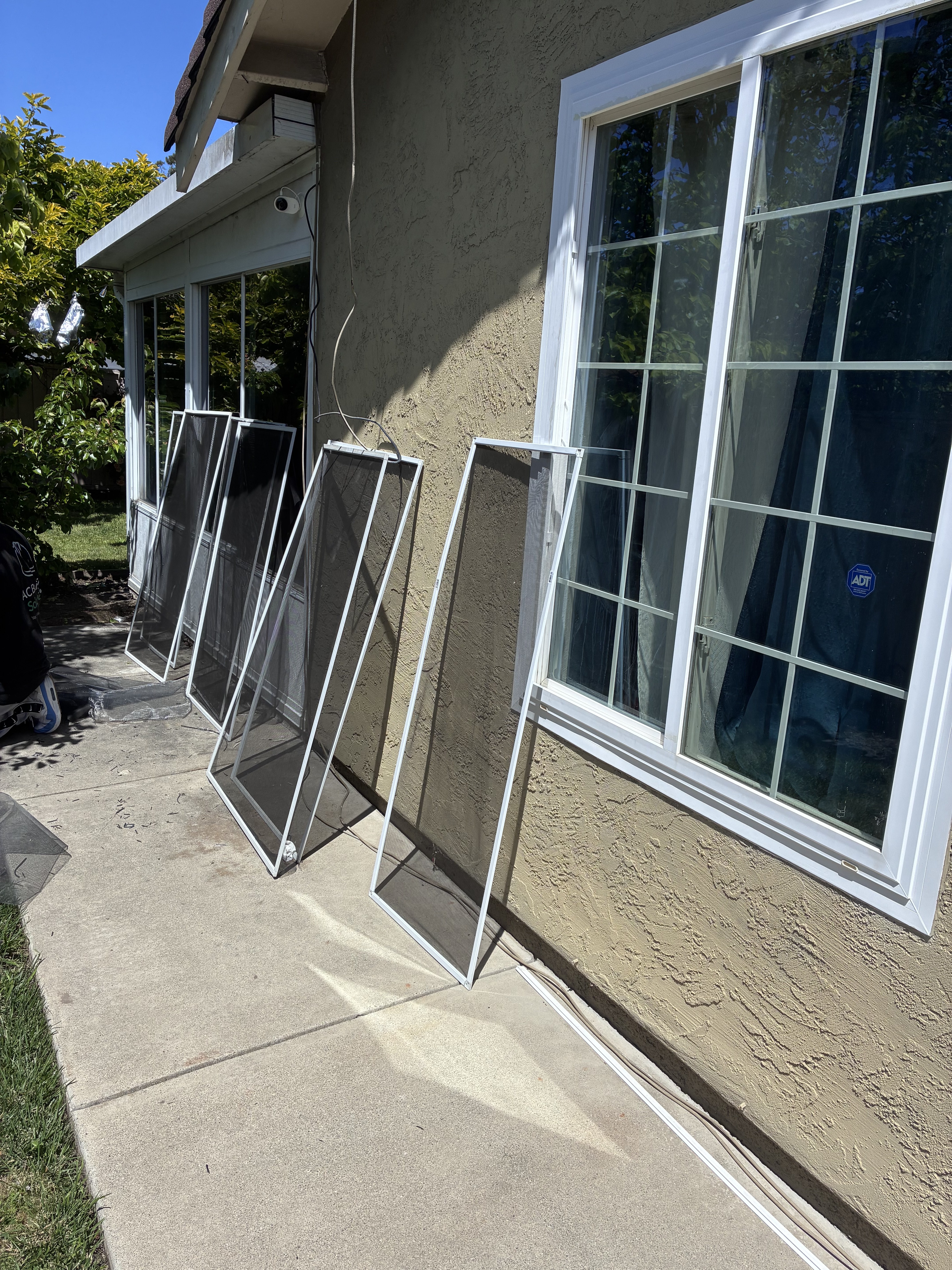 New windows ready to install with screens set out